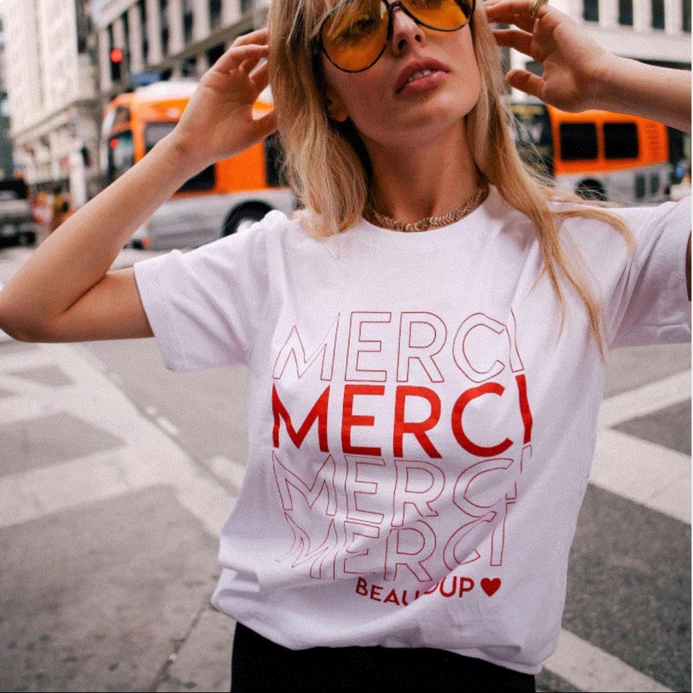 White Short Sleeve Tee with Red 'MERCI' Graphic